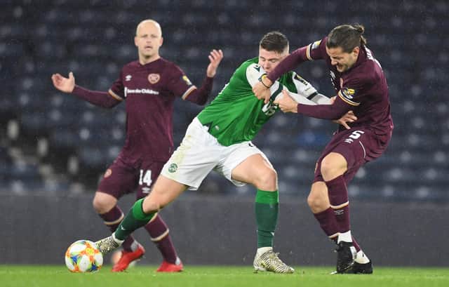 Hibs striker Kevin Nisbet battling for possession against Hearts earlier in the season. Picture: SNS