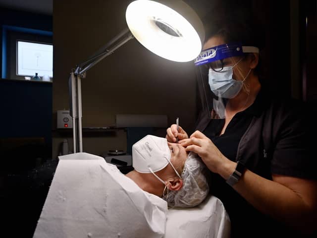Allowing customers to remove masks for beauty treatments would help salons 'save themselves from the brink', according to the group (file image). Picture: Eric Lalmand/Belga/AFP via Getty Images.