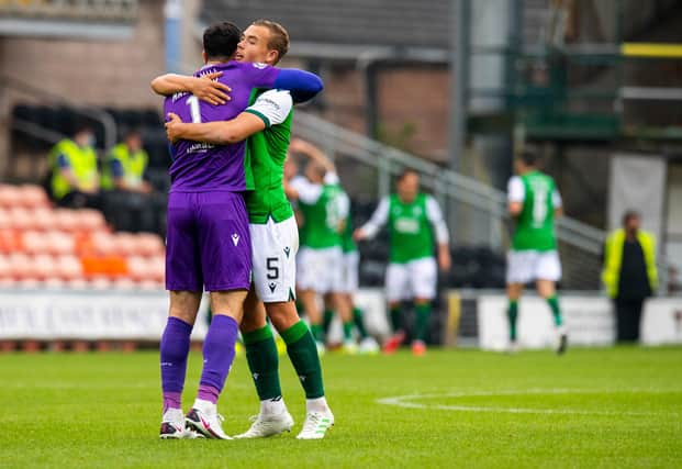 Ryan Porteous embraces Ofir Marciano as Hibs made it three wins out of three