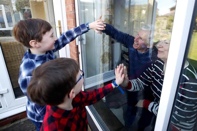 For many, this is the closest they have been able to get to loved ones during the lockdown. Photo: Martin Rickett/PA Wire