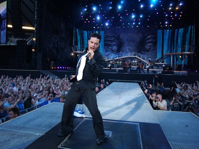 Pop singer Robbie Williams in concert at Murrayfield Stadium in Edinburgh on Sunday, June 29, 2003.