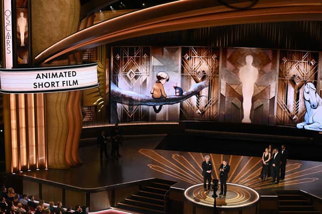 Charlie Mackesy and Producer Matthew Freud accept the Oscar for Best Animated Short Film for 'The Boy, the Mole, the Fox and the Horse' onstage during the 95th Annual Academy Awards. (Photo credit: PATRICK T. FALLON/AFP via Getty Images)