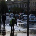 Edinburgh's Comely Bank Road flooded by a burst water main on nearby Comely Bank Avenue - Scottish Water workers were called to the scene to unblock drains as the street began to fill with water.