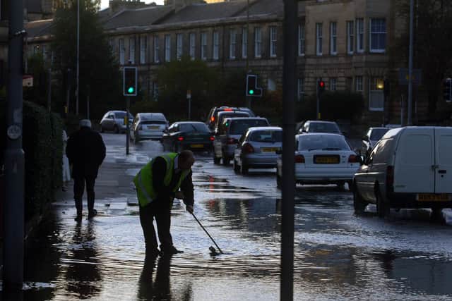 Edinburgh's Comely Bank Road flooded by a burst water main on nearby Comely Bank Avenue - Scottish Water workers were called to the scene to unblock drains as the street began to fill with water.