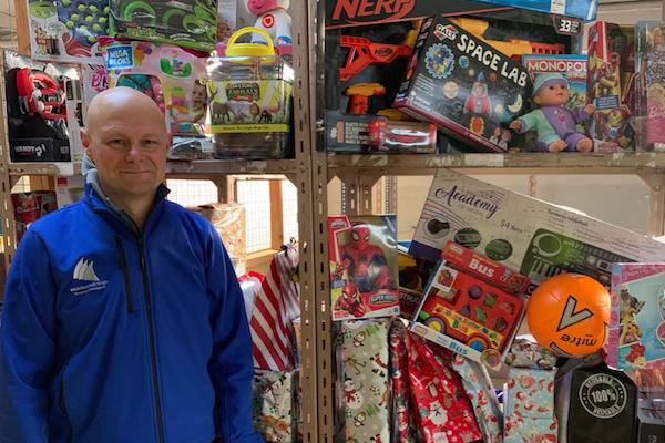 Middleton Grange shopping centre's Giving Tree collected a staggering 177,000 Christmas presents for disadvantaged children after moving online for the first time due to coronavirus.  Manager Mark Rycraft is seen here with a small fraction of the gifts.