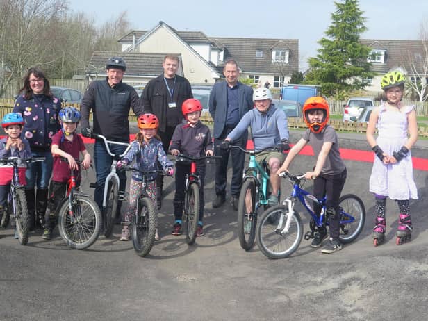 Left to right are: Midlothian Council's Cabinet Member for green spaces, Cllr Dianne Alexander, Robert, 7, Sarah Anderson, Douglas, 8, Neil Wilson, Fiona, 6,  Cabinet Member for health and wellbeing Cllr Connor McManus, Logan, 9, James Kinch of Midlothian Council’s Landscape and Countryside Service, Chris Todd, Charlie, 7, and Kara, 9.