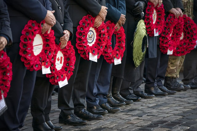 Dignitaries and members of the Armed Forces with poppy wreaths to be placed at the Stone of Remembrance during the Remembrance Sunday service and parade in Edinburgh. 
Photo: Jane Barlow/PA Wire