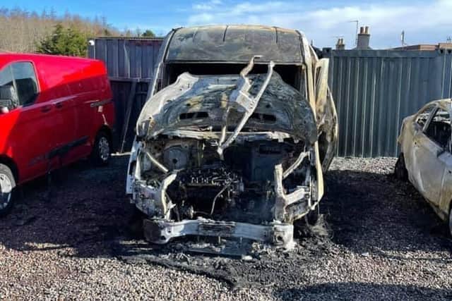 Pictured is one of four cars set on fire at Loanhead Car Sales.