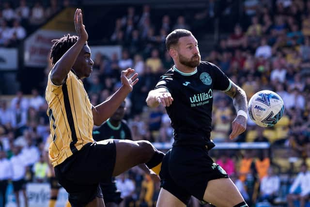 Livingston's Stephen Omeonga challenges Martin Boyle in the box before the Hibs forward goes down, but the referee correctly waved play on. Picture: Alan Harvey / SNS