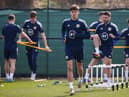 Aaron Hickey training with Greg Taylor, another left-back, behind him at Oriam in Edinburgh ahead of the friendly against Poland at Hampden on Thursday