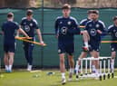 Aaron Hickey training with Greg Taylor, another left-back, behind him at Oriam in Edinburgh ahead of the friendly against Poland at Hampden on Thursday