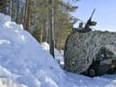 A Swedish armoured vehicle sits by a snow drift during a military exercise with several Nato members in the country's north-east in 2019 (Picture: Naina Helen Jama/AFP via Getty Images)