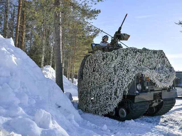 A Swedish armoured vehicle sits by a snow drift during a military exercise with several Nato members in the country's north-east in 2019 (Picture: Naina Helen Jama/AFP via Getty Images)