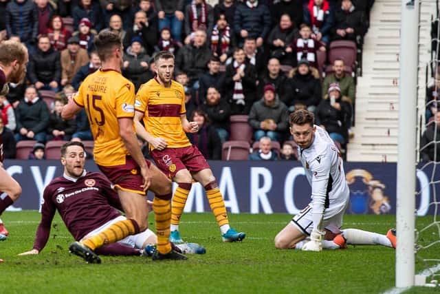 Conor Washington slides home the equaliser for Hearts in their 1-1 draw with Motherwell. Picture: SNS