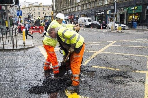 A pothole being repaired on Lothian Road following a pothole repair campaign. 12 March 2018