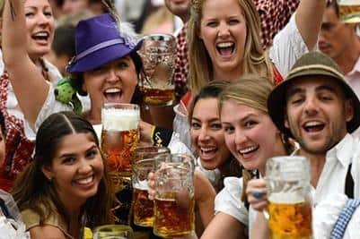 Crowds at Edinburgh Oktoberfest, where German food, beer and live music can be found.