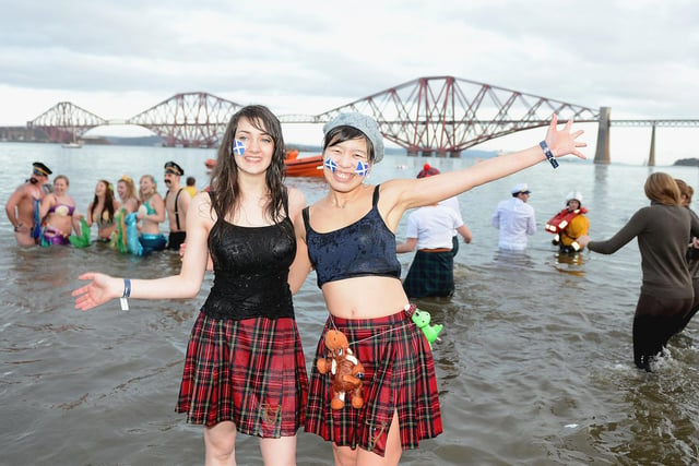 These two were among about 1,000 New Year swimmers who braved the cold water during the 2014 Loony Dook.