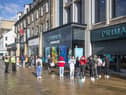 People queue outside the flagship Primark store on Princes Street in Edinburgh after it reopened following the initial spring 2020 lockdown. Picture: Jane Barlow/PA Wire