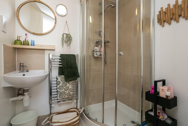 The well-presented en-suite bathroom connected to the stylish property's principal bedroom.