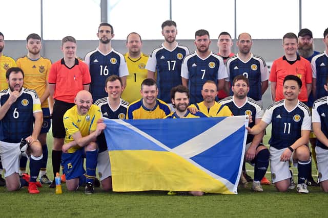 Stock photo by John Devlin 24/03/2022. Tartan Army Select stand in solidarity with Ukraine by teaming up for fan charity match at Toryglen Football Centre.