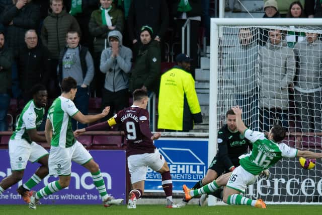 Lawrence Shankland opens the scoring for Hearts as the striker reacts quickest to get to the rebound after David Marshall saved in the Hibs goal. Picture: SNS