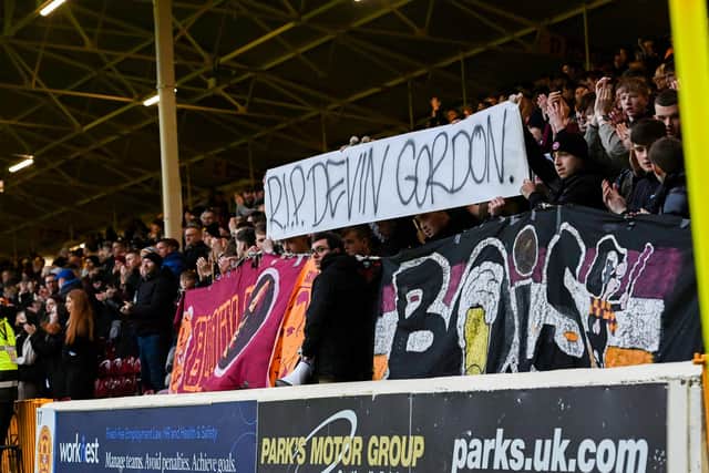 Motherwell fans pay tribute to Devin Gordon during the Scottish Cup 4th round match between Motherwell and Greenock Morton at Fir Park, on January 22, 2022, in Motherwell, Scotland (Photo by Paul Devlin / SNS Group).