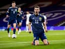 Ryan Christie celebrates after scoring for Scotland from the penalty spot.