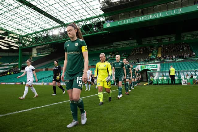 Captains Joelle Murray (L) and Kelly Clark (R) lead their teams out at Celtic Park yesterday. (Photo by Craig Williamson / SNS Group)