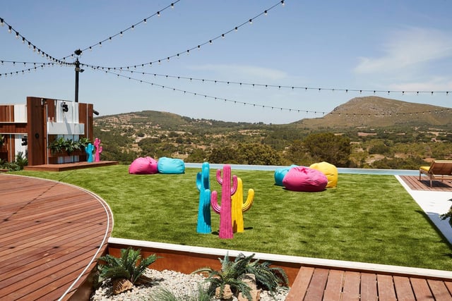 The garden is dotted with the usual colourful bean bags, now with matching fake cactuses as some extra decoration. The villa looks out onto the surrounding landscape of Mallorca.
