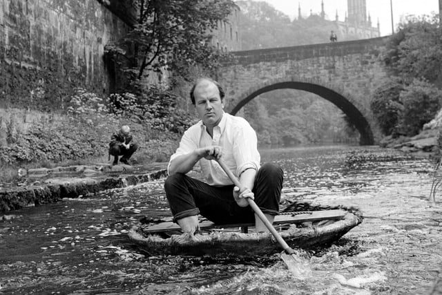 David Hayes can be seen here taking the coracle he built to the Water of Leith at Dean Village. Year: 1970
