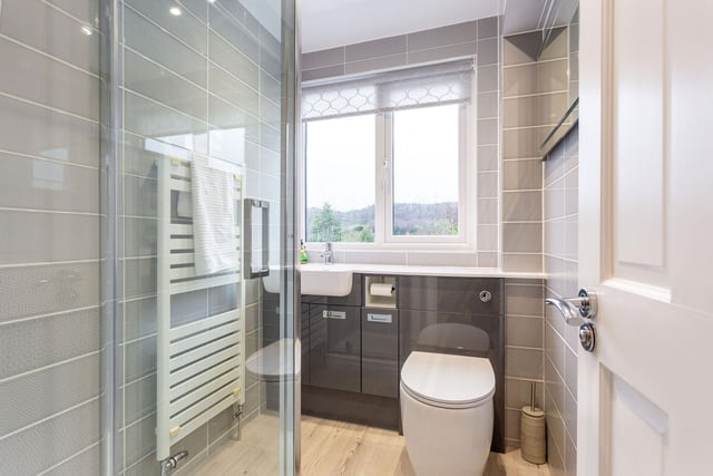 The modern tiled shower room with walk-in shower.