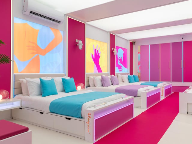The main bedroom comes decorated with the usual tasteful fluorescent colours and catchphrases