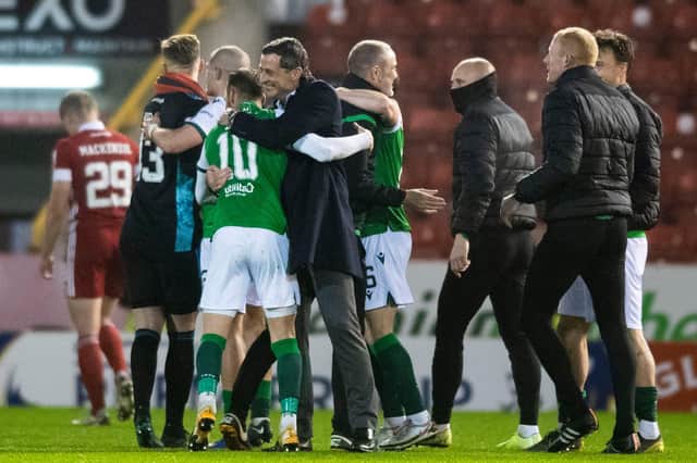 Hibs players celebrate at full time during the Scottish Premiership match between Aberdeen and Hibernian at Pittodrie. Photo by Mark Scates / SNS Group