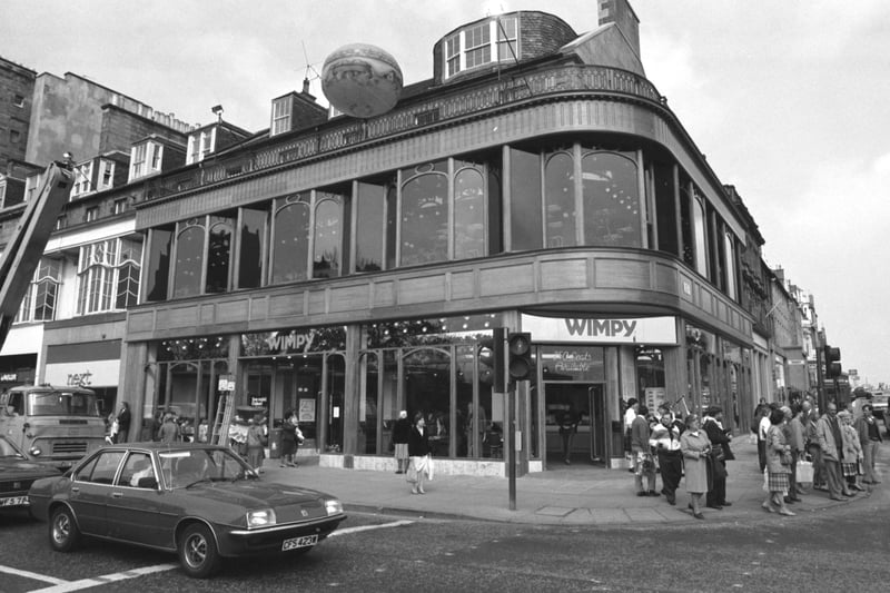 Wimpy had two restaurants on Princes Street in the 1990s, including this one that opened at the corner of Castle Street and Princes Street in Edinburgh, May 1984. The other was at the east end, in what is now the Apple store. Most Edinburgh kids attended birthday parties upstairs at both, as well as trips there with friends as a teenager in the 90s on a Saturday afternoon.