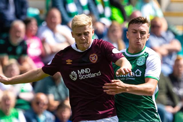 Campbell gets to grips with Hearts' Alex Cochrane during the last derby clash