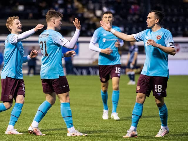 Ewan Henderson celebrates after doubling the scoring for Hearts. Picture: SNS