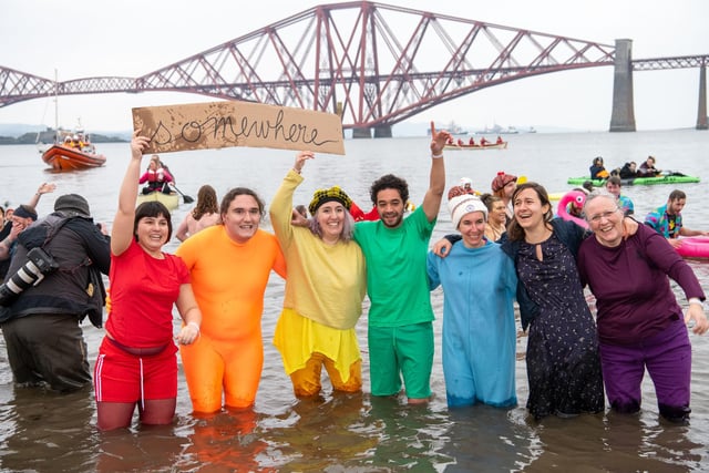 Fancy dress is a regular feature of the Loony Dook.  These friends dressed in red, orange, yellow, green, blue, indigo and violet to give a rainbow start to the new year in 2020.