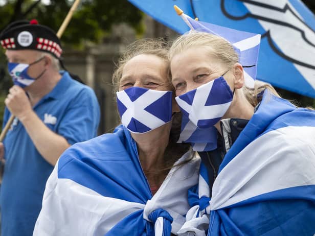 Members from All Under One Banner take part in a static demonstration for Scottish independence outside the Scottish Parliament in Edinburgh earlier this year