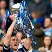 Jackson Irvine lifts the League Cup with Ross County in 2016.