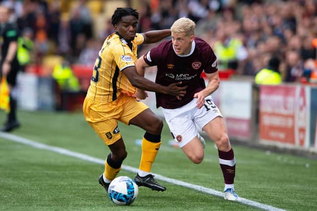Livingston’s Stephane Omeonga and Hearts’ Alex Cochrane in actin during Saturday's match.
