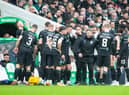 Lee Johnson speaks to his outfield players during a break in play in the 3-1 defeat by Celtic