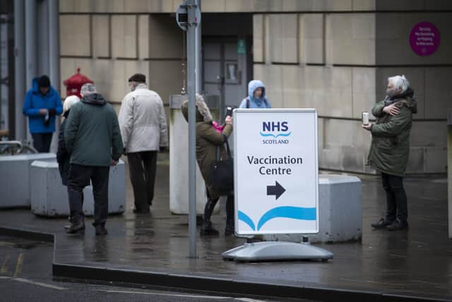 Members of the public outside the main entrance to the coronavirus mass vaccine centre at the Edinburgh International Conference Centre. Picture date: Monday February 1, 2021.