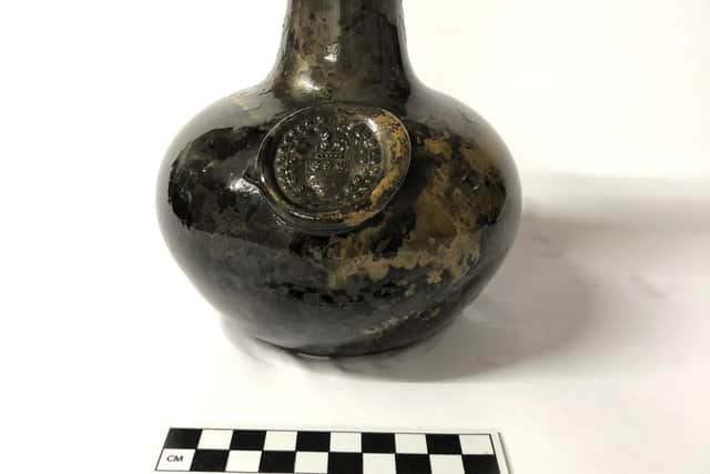 One of the bottles found with the wreck, which bears a glass seal with the crest of the Legge family who are ancestors of George Washington, the first US President
Pic: University of East Anglia