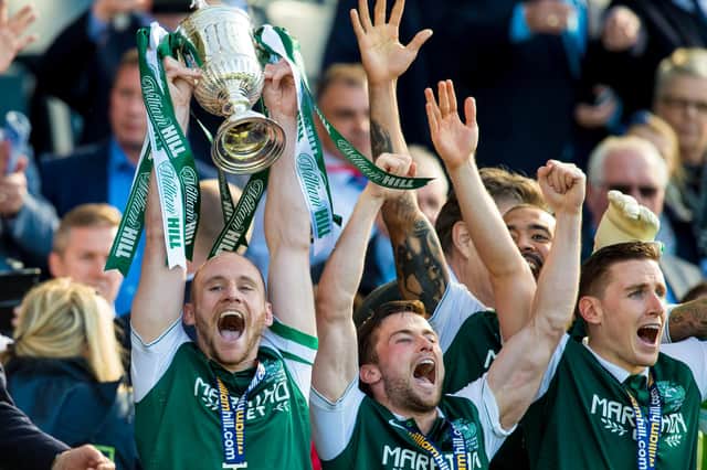 Hibs captain David Gray (left) lifts the Scottish Cup, as he and his team mates celebrate winning the Scottish Cup on May 21, 2016.