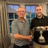 Bathgate's Scott McCandless, right, is presented with the Lothians Champion of Champions Trophy by LGA President Neil Anderson. Picture: LGA