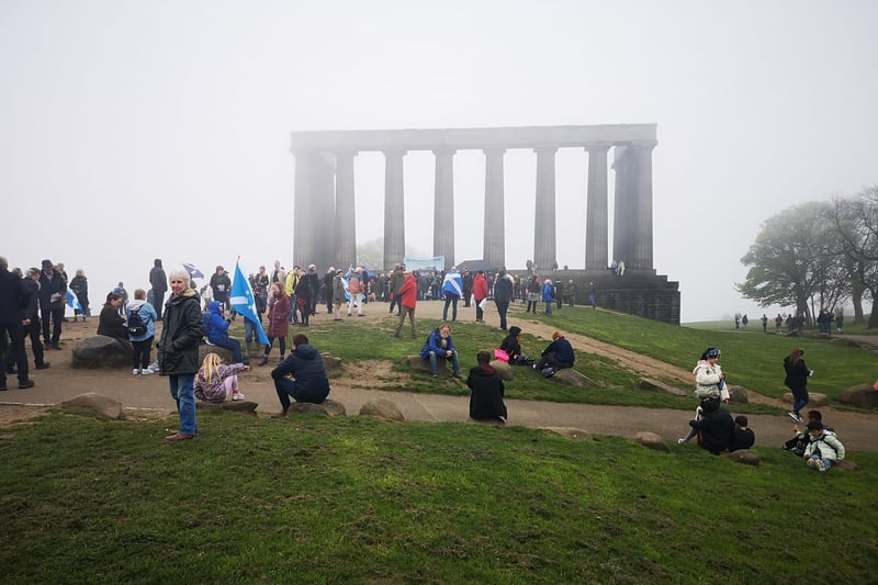 Calton Hill looking atmospheric in the fog while crowds gather for the demonstration.