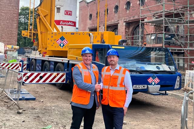 Bernard Hunter managing director Mark Rafferty with council leader Cammy Day and the crane.