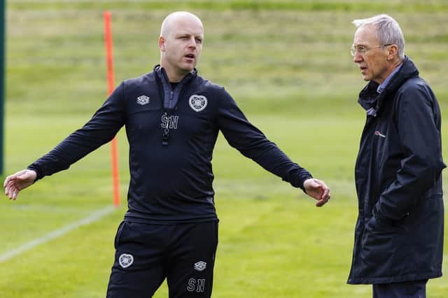 Steven Naismith speaks to and non executive director Donald Cumming during a training at the Oriam