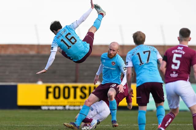 Andy Halliday crashes back to earth after trying to evade a first-half challenge. Picture: SNS