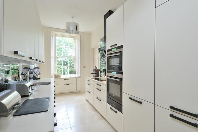 The kitchen, which is clearly the most modern room in the house, can be accessed both from the hall and the drawing room. This sleek and contemporary kitchen is by Kitchens International and has a range of high quality units and appliances.